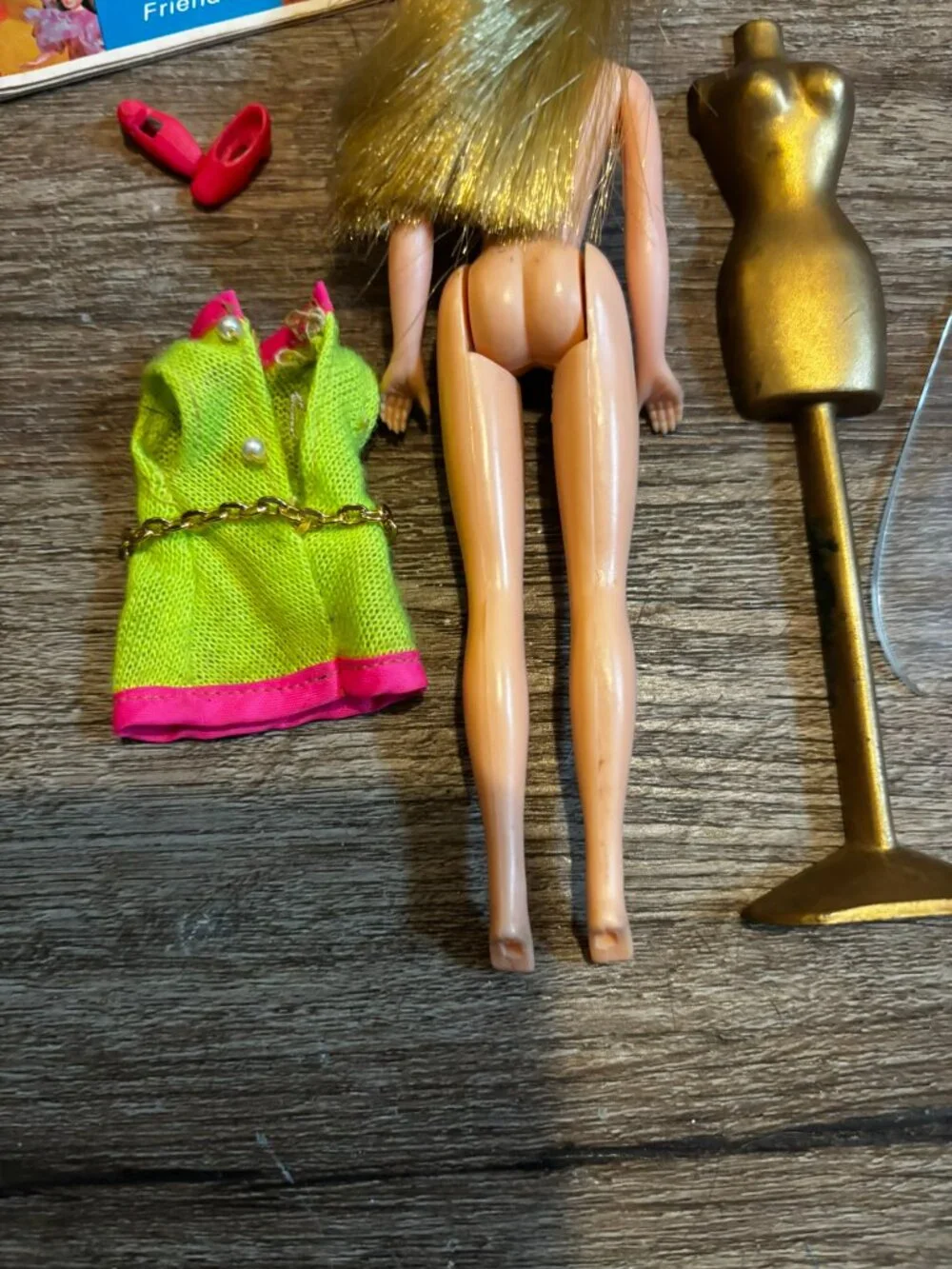 Topper Dawn Fancy Feet doll wearing lime green and pink hard straight legs